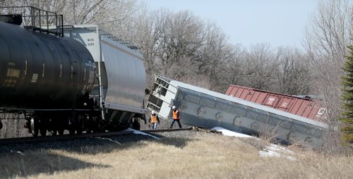 CN Rail employees at the scene after a few cars derailed on a section of track next to Pembina Highway in St.Norbert, Sunday, April 20, 2014. There were no injuries, and the contents pose no environmental risk. (WINNIPEG FREE PRESS)