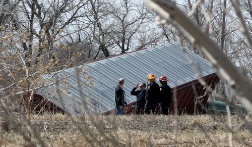 CN Rail employees, investigators and responders were at the scene after a few cars derailed on a section of track next to Pembina Highway in St.Norbert, Sunday, April 20, 2014. There were no injuries, and the contents pose no environmental risk. (WINNIPEG FREE PRESS)