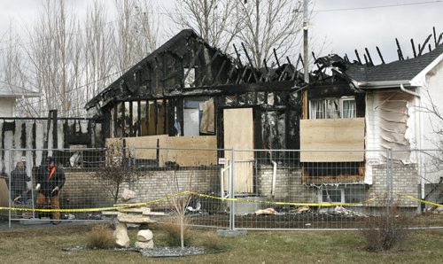 The scene Monday morning after fire damaged the home in Lorette, Mb. Saturday evening. All occupants of the house escaped safely. The fire started in an electrical outlet in the attached garage and spread to the house.see web story Wayne Glowacki / Winnipeg Free Press April 21   2014