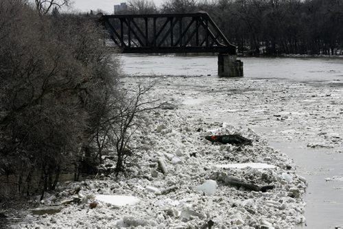A view south from the Kildonan Bridge over the Red River. Ice build up and a loose dock near the shore.   Wayne Glowacki / Winnipeg Free Press April 21   2014