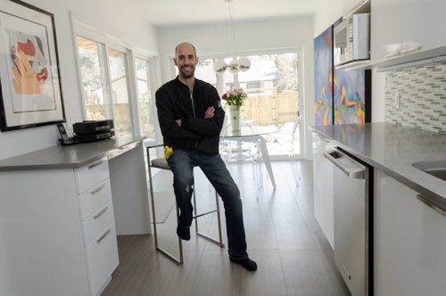 Ivan Plett, project manager for Rempel Builders, poses for a photo in a kitchen that was recently renovated.  EMILY CUMMING / WINNIPEG FREE PRESS