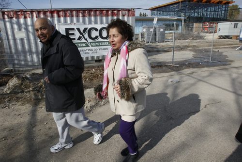 April 21, 2014 - 140421  -  Nat and Dinesh Gadhok comment on the Assiniboine Zoo rate increases as they walk past a new building at the zoo Monday, April 21, 2014. John Woods / Winnipeg Free Press