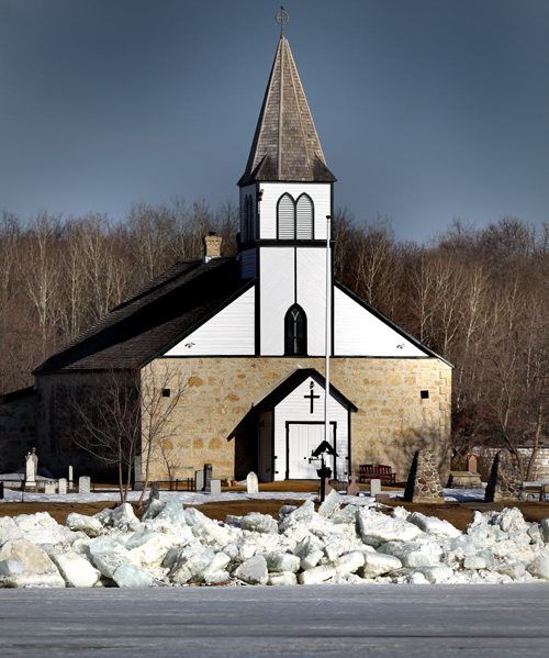 Ice is pushed up the shore in front of St Peters historic Anglican Church north pof Selkirk Monday. See Rollason's story. April 21, 2014 - (Phil Hossack / Winnipeg Free Press)