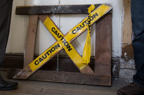 A caution sign leans against a wall of the mostly unused top floor of the Burton Cummings Theatre in Winnipeg on Friday, March 21, 2014. True North Sports and Entertainment is taking over the management of the theatre and has many necessary upgrades planned. (Photo by Crystal Schick/Winnipeg Free Press)