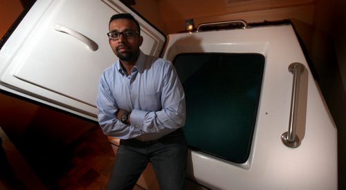 Roi Jones, co-owner of Flotation Therapy Winnipeg, poses with their "Sensory Deprivation Tank". See Wendy Sawatzky's tale. April 23, 2014 - (Phil Hossack / Winnipeg Free Press)