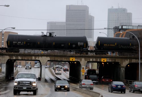 newer larger chemical rail cars cross over Main St daily .LOCAL STDUP . New File for rail safety , chemical rail cars carrying hazardous materials through populated cities , many older cars will be taken out of service . Pic taken on Main St  at Sutherland  APRIL 24 2014 / KEN GIGLIOTTI / WINNIPEG FREE PRESS