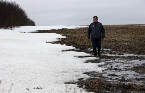 BIZ .  McRae farm near St. Andrews north on Hwy. 8  . Grain and cattle farmer CURTIS MCRAE, who is also a vice-president of the Keystone Agricultural Producers, in his field or yard that still has snow on the ground. For a story on how this yearÄôs spring seeding season will have another  late start to the late arrival of spring, and what Manitoba farmers are planning to plant this year. (More soybeans, dry beans, sunflower seed and flaxseed, about the same amount of canola as last year, and less wheat, oats, barley and corn) Story by Murray McNeill . APRIL 24 2014 / KEN GIGLIOTTI / WINNIPEG FREE PRESS