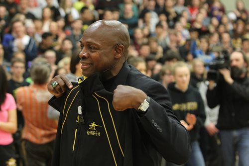 Famed basketball coach Ken Carter shows off his Dakota Lancers jacket given to him by the school  after speaking to students on the importance of education Thursday.     -  Carter was made famous by the movie portrayal of his time coaching basketball at Richmond High School, a struggling school in California.   April 24, 2014 Ruth Bonneville / Winnipeg Free Pres