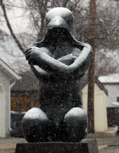 WEATHER STANDUP - Some sculptures get covered with snow in front of Loch Gallery at 306 St Mary's Rd. BORIS MINKEVICH / WINNIPEG FREE PRESS April 24, 2014