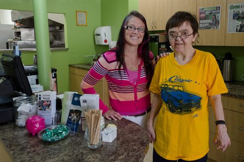 L'Arche Winnipeg, a residential home for adults with special needs, runs a cafe where some of those residents can find jobs.  Rachel Bobeil, the Front Server Supervisory at L'Arche Tova Cafe poses with Hazel, a resident who works at the cafe.  EMILY CUMMING / WINNIPEG FREE PRESS