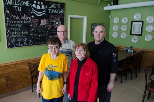 Hazel (from left), Jim Lapp, Executive Director, Diane Truderung, Director of Fund Development and Chef Nick Morier pose for a photo at L'Arche Tova Cafe.  L'Arche Winnipeg, a residential home for adults with special needs, runs a cafe where some of those residents can find jobs.  EMILY CUMMING / WINNIPEG FREE PRESS