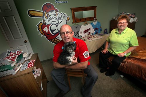 Bruce and Linda Ward, a "billet" family that hosts Goldeye players during the baseball season. They're posing in the basement bedroom they give to the player. See Melissa Martin's story. April 25, 2914 - (Phil Hossack / Winnipeg Free Press)