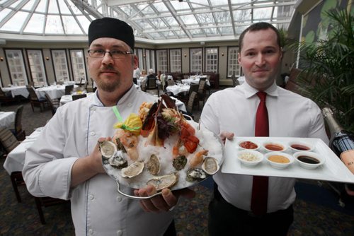 Terrace in the Park-  Chef Justin LeFrancois, left, with seafood tower for two and Staninslav Anikin General Manager with special sauces- See Marion Warhaft review- Apr 25, 2014   (JOE BRYKSA / WINNIPEG FREE PRESS)