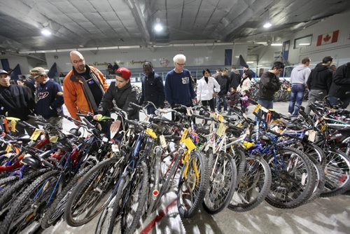 Hundreds of interested buyers check out the rows of stacked bikes at  the city of Winnipeg's annual bike auction at Varsity View Area Saturday.  April 26, 2014 Ruth Bonneville / Winnipeg Free Pres