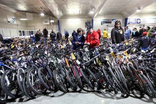 Hundreds of interested buyers check out the rows of stacked bikes at  the city of Winnipeg's annual bike auction at Varsity View Area Saturday.  April 26, 2014 Ruth Bonneville / Winnipeg Free Pres