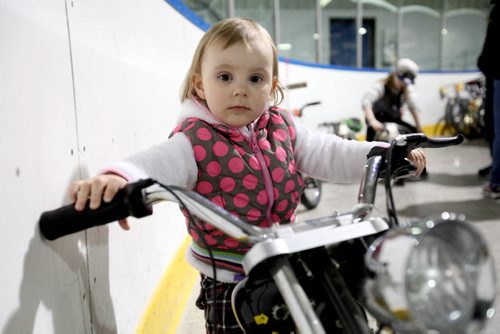 Two year old Emma Landel tries out a little low-rider bike while attending the city of Winnipeg's annual bike auction at Varsity View Area Saturday with her family.   April 26, 2014 Ruth Bonneville / Winnipeg Free Pres