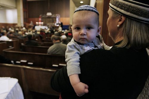 April 27, 2014 - 140427  -  Ronen and his mom Ashira Mass listen as his dad Anibal Mass reads from the first chapter at the 7th annual reading of Megillat Hashoah, the Holocaust Scroll, at Shaarey Zedek Synagogue Sunday, April 27, 2014. The Megillat Hashoah was written by Avigdor Shinan, a professor of Hebrew literature at Hebrew University in Jerusalem and unveiled at a Holocaust Memorial Day service in Toronto on April 29. 2003. John Woods / Winnipeg Free Press