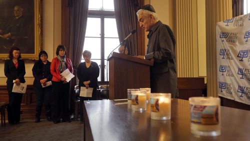 LOCAL - Stan Carbone director of programing for the   Jewish Heritage  Centre of Western Canada  reads names victims of the Holocaust   at Mb. Legislature HOLOCAUST MEMORIAL DAY COMMEMORATION THE LEAGUE FOR HUMAN RIGHTS OF B'NAI BRITH CANADAÄôS "UNTO EVERY PERSON THERE IS A NAME" .ANNUAL HOLOCAUST MEMORIAL DAY COMMEMORATION , Manitoba Legislative Building in Committee Room 254 ,This program, through reflection, poetry, testimony, and the reading of names and origins of victims of the Holocaust, which have been transcribed from the Holocaust Monument on the grounds of the Manitoba Legislature, is intended to drive home the individual nature of the tragedy that befell all victims of the Holocaust, Jewish and non-Jewish alike. It is meant to illustrate the horrible results of hatred and hate- motivated ideology, and to help ensure that such beliefs and principles find no fertile ground here APRIL 28 2014 / KEN GIGLIOTTI / WINNIPEG FREE PRESS