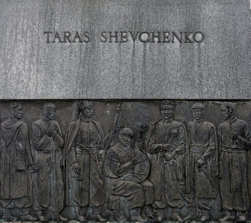 PICTURE PAGE : Rain stdups for picture page : Tara Shevchenko statue of Ukrainian  poet  at the Manitoba Legislature has rain falling like tears falling on  it . APRIL 28 2014 / KEN GIGLIOTTI / WINNIPEG FREE PRESS