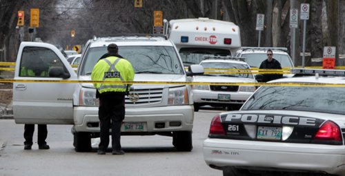 Winnipeg Police at the intersection of Grosvenor Avenue and Wilton Street after a person was struck by a vehicle Monday morning. web story   Wayne Glowacki / Winnipeg Free Press April 28   2014