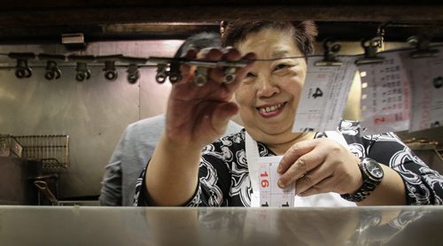 One of Winnipeg's iconic asian restaurants, Foon Hai, spent the last 53 days with frozen pipes. Employees are very happy that the business now has running water and the food orders were steady during the lunch hour. Manyuk Dare organizes the orders in the kitchen as a steady stream of customers called for take-out. 140428 - Monday, April 28, 2014 -  (MIKE DEAL / WINNIPEG FREE PRESS)