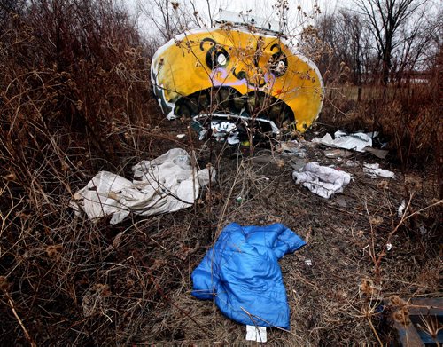 A "campsite" along the Red River near Higgins ave sits hidden in weeds behind the river bank. April 28, 2014 - (Phil Hossack / Winnipeg Free Press)