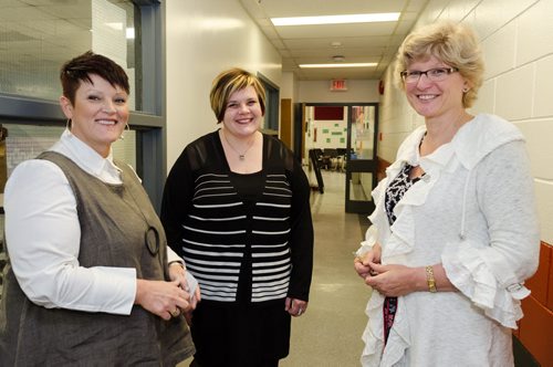 (From left) Janet Martell, Superintendent of Lakeshore School Division, Leanne Peters, Assistant Superintendent and Principal Susan Hayward stands in the hallway of Lundar High School.  The graduation rate in Lakeshore School Division has risen from 50% in 2009 to 92% in 2013. EMILY CUMMING / WINNIPEG FREE PRESS