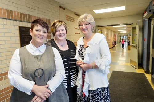 (From left) Janet Martell, Superintendent of Lakeshore School Division, Leanne Peters, Assistant Superintendent and Principal Susan Hayward stands in the hallway of Lundar High School.  The graduation rate in Lakeshore School Division has risen from 50% in 2009 to 92% in 2013. EMILY CUMMING / WINNIPEG FREE PRESS