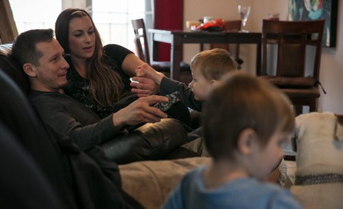 Aurora, and her partner Rob, at home with their two sons Darius, 2, and Gabriel, 5. Rob works as a soffit & fascia contractor on new home construction, while Aurora works mostly weekend nights exotic dancing. 140428 - Monday, April 28, 2014 - (Melissa Tait / Winnipeg Free Press)