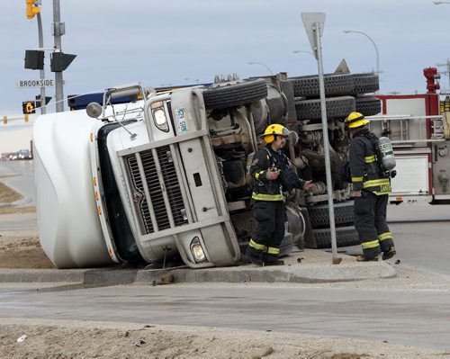 LOCAL  - A semi has over turned on Inkster Blvd at Brookside Blvd  , the driver was shaken up , fire and ambulance are on scene , traffic is getting around the incident . APRIL 30 2014 / KEN GIGLIOTTI / WINNIPEG FREE PRESS