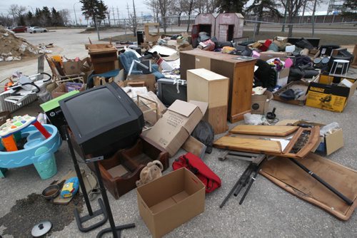 Canadian Diabetes donation  drop off bins on the City of Winnipeg site at 1539 Waverley St   It appears that people are dropping off junk here to avoid charges at dump- Site is littered with garbage including some construction waste-See  possible  story- Apr 30, 2014   (JOE BRYKSA / WINNIPEG FREE PRESS)