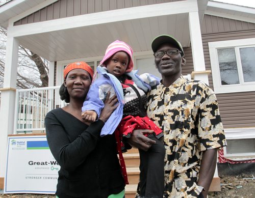 At right, Lino Gomik, along with his partner, Jasinta Lanyom and their daughter Susan in front of their new Habitat for Humanity home. (the address is not to be published)  Carol Sanders story.  Wayne Glowacki / Winnipeg Free Press April 30   2014