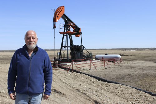013 - George Wady stands in front of the oil well in which he shares mineral rights, in the new Birdtail Field near Birtle. BILL REDEKOP/WINNIPEG FREE PRESS April28, 2014