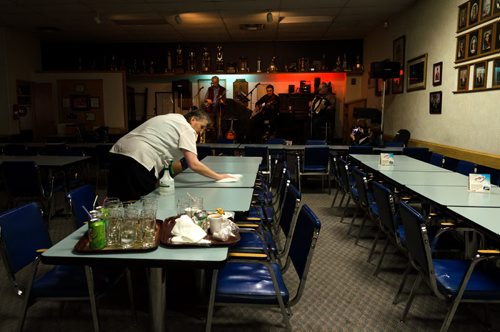 A staff member cleans up table after lunch at the General Sir Sam Steele Legion on a Wednesday afternoon.  The legion puts on a weekly luncheon and dance.  EMILY CUMMING / WINNIPEG FREE PRESS