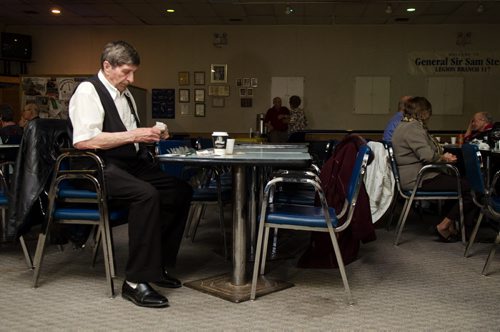 A patron checks his scratch tickets at the General Sir Sam Steele Legion on a Wednesday afternoon.  The legion puts on a weekly luncheon and dance.  EMILY CUMMING / WINNIPEG FREE PRESS