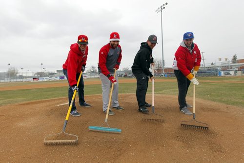 Rory Mitchell, catcher, Paul Esteves, outfielder, Brendan Gaunt, ss, and Zach Campbell, pitcher, works on mound at Chalmers Community Club in Elmwood. University of Winnipeg Wesman baseball team is going to go outdoors. BORIS MINKEVICH / WINNIPEG FREE PRESS  April 30, 2014