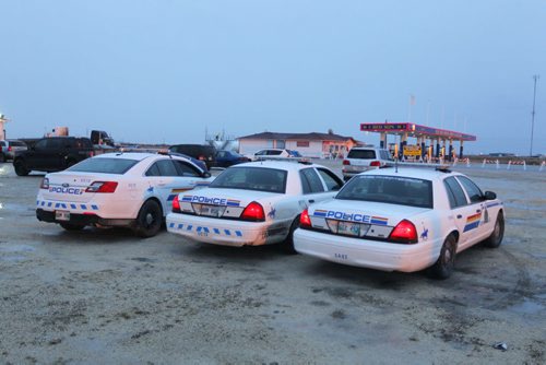 Red Sun Smoke Shop and Gas Bar eviction scene. RCMP on standby to keep the peace if needed. BORIS MINKEVICH / WINNIPEG FREE PRESS  April 30, 2014