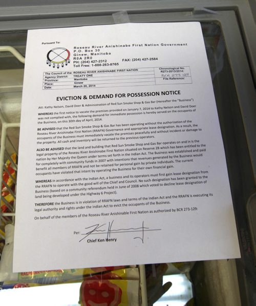 Eviction and Demand Possession Notice from the Roseau River Anishinabe First Nation  posted inside the Red Sun Smoke Shop after it was seized last night from its former operators   See  Carol Sanders story- May 01, 2014   (JOE BRYKSA / WINNIPEG FREE PRESS)