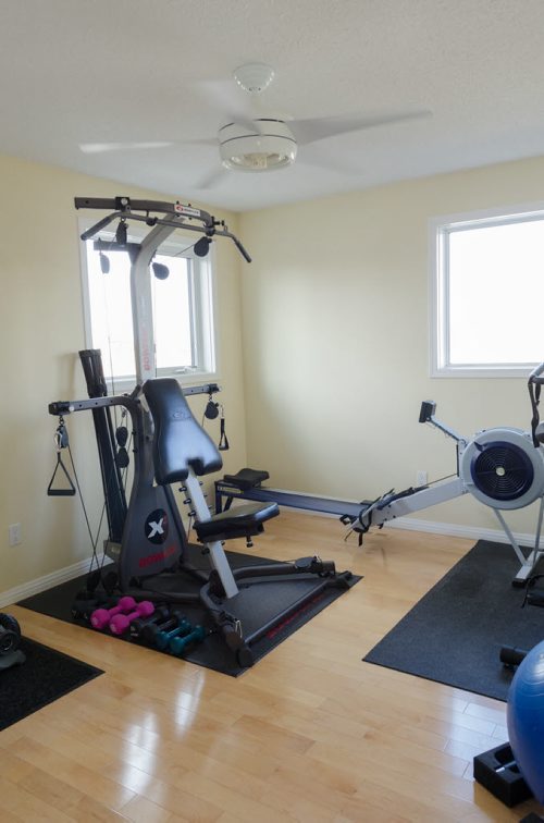 Spare second floor bedroom, currently being used as a gym, at 81 Shorecrest Drive in Lindenwood.  EMILY CUMMING / WINNIPEG FREE PRESS