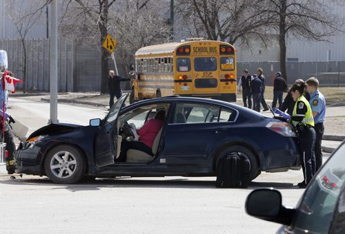 MVC car into a school bus filled with students , the car driver was transported to hospital , school kids are being asscesed  , by WpG Paramedics  , non of the kids are  thought to be injured  - MVC  on Pandora East at  Plesiss May 1 2014 / KEN GIGLIOTTI / WINNIPEG FREE PRESS