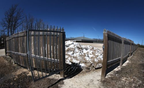 A seven foot high wood fence and seteel gates surrounds theChristian Fundamentalist's Plymouth Bretheren "Meeting Hall" in Woodlands. May 1, 2014 - (Phil Hossack / Winnipeg Free Press)