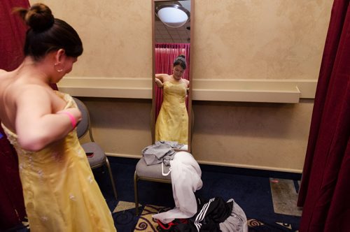 Rebecca McLean, 19, tries on a dress at the Gowns for Grads program.  Gowns for Grads is a volunteer program that provides used and new dresses for graduation.  EMILY CUMMING / WINNIPEG FREE PRESS