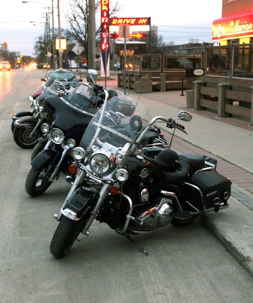LOCAL STANDUP - The Harley Davidsons are a sign of great weather. Here parked on Marion in front of the Marion Hotel. BORIS MINKEVICH / WINNIPEG FREE PRESS  May 1, 2014