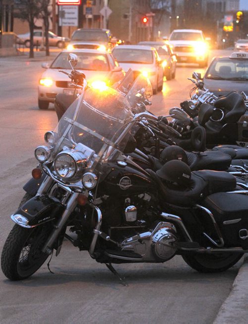 LOCAL STANDUP - The Harley Davidsons are a sign of great weather. Here parked on Marion in front of the Marion Hotel. BORIS MINKEVICH / WINNIPEG FREE PRESS  May 1, 2014