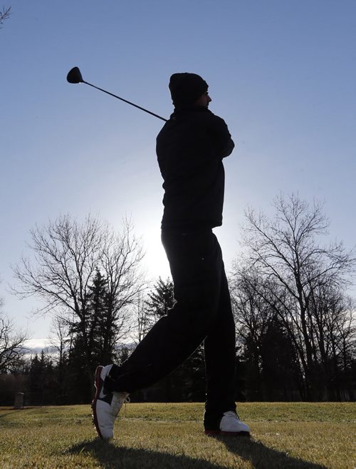 STDUP Äì Tuxedo Golf Course opened for the season at 8am Friday , John Ali takes practice swings for his first time this year in cool but sunny conditions , Holes 8 and 13 are still a bit wet but the course is ready to go .May 2 2014 / KEN GIGLIOTTI / WINNIPEG FREE PRESS