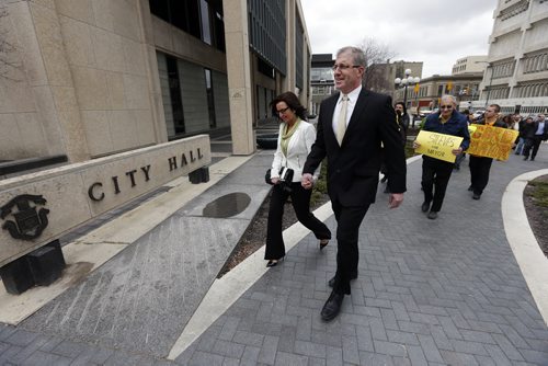 LOCAL ,City Hall , Gord Steeves  accompanied by his  wife Lorrie and a parade of supporters  signs paper to join the race for becoming Mayor og Winnipeg in  the next election  May 2 2014 / KEN GIGLIOTTI / WINNIPEG FREE PRESS