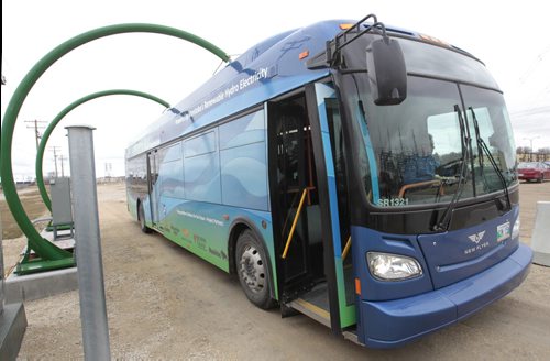 The first made in Manitoba prototype electric transit bus is charged up at the rapid charging station at the Manitoba Hydro Taylor Ave. location.    Bruce Owen story. Wayne Glowacki / Winnipeg Free Press May2 2014