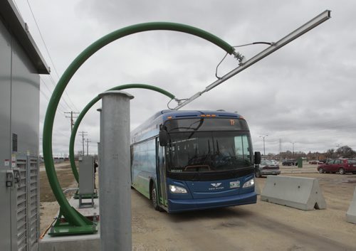 The first made in Manitoba prototype electric transit bus is about to pull up underneath the rapid charging station at the Manitoba Hydro Taylor Ave. location.    Bruce Owen story. Wayne Glowacki / Winnipeg Free Press May2 2014