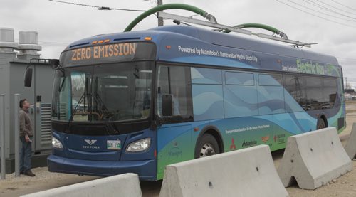 The first made in Manitoba prototype electric transit bus is charged up at the rapid charging station at the Manitoba Hydro Taylor Ave. location.    Bruce Owen story. Wayne Glowacki / Winnipeg Free Press May2 2014