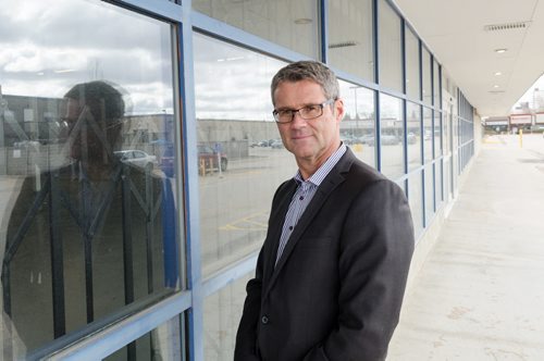 John Prall of Colliers International stands in front of a building that is due to be leased.  The building has sat empty for nearly three years, since the Office Depot closed.  EMILY CUMMING / WINNIPEG FREE PRESS
